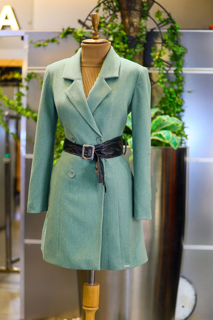 Real photographed green coat on mannequin